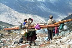 
A Tibetan couple coming down from the Shao La carrying large logs stopped and chatted with one of the our yak herders, sharing some rakshi.
